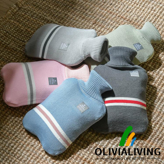 Five OliviaLiving Classic 2L striped-cover hot water bottles on a home rug