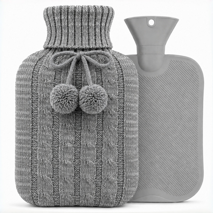 Light Grey OliviaLiving 2L hot water bottle with pom-pom knit cover shown beside the grey bottle