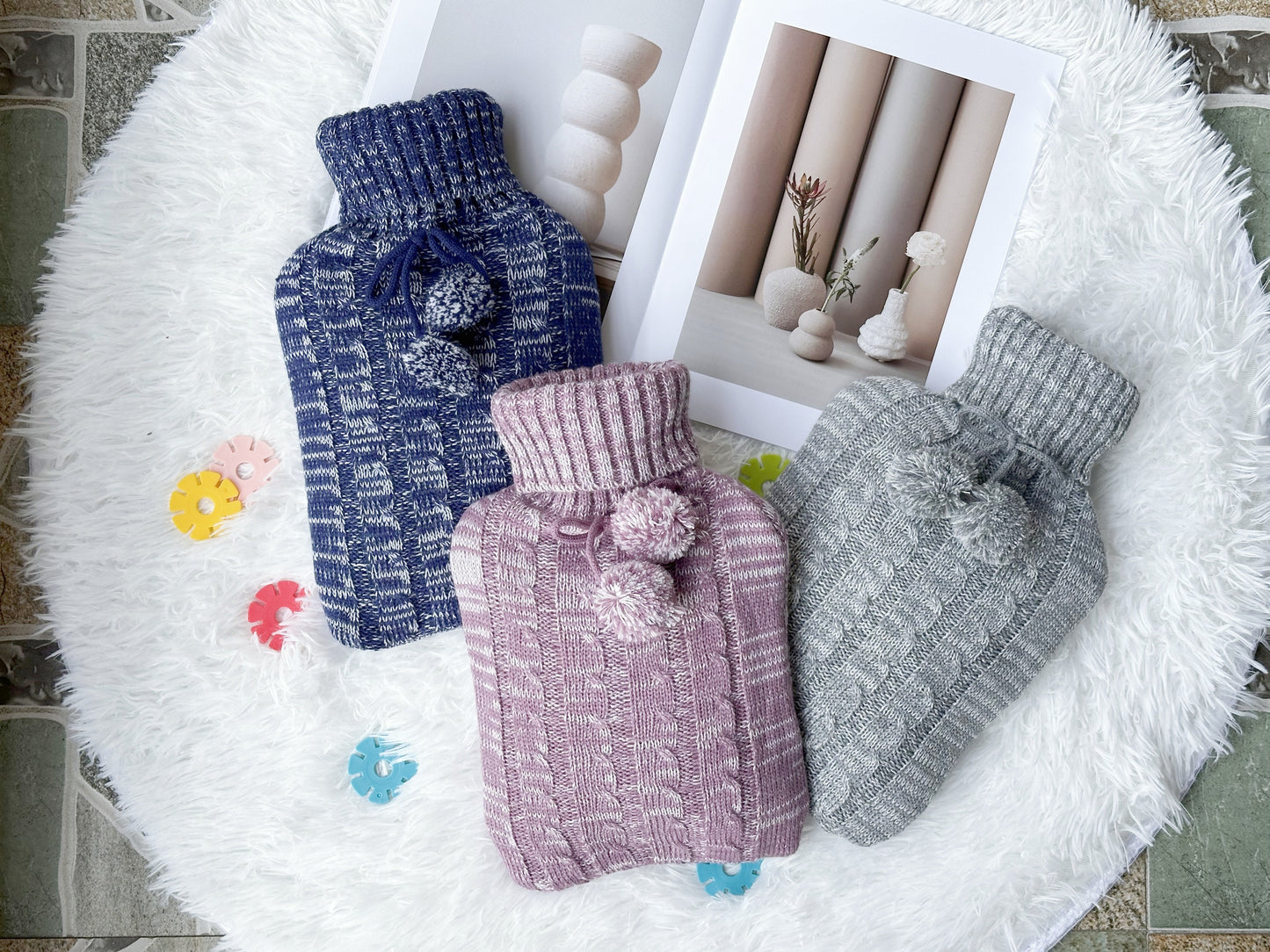 OliviaLiving blue, pink and light grey 2L hot water bottles with pom-pom knit covers