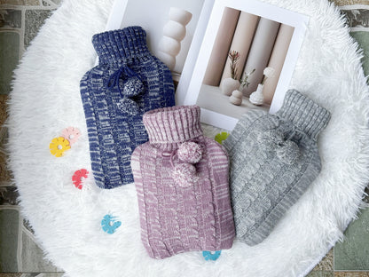 OliviaLiving blue, pink and light grey 2L hot water bottles with pom-pom knit covers